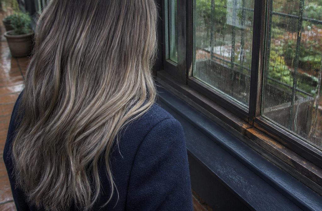Dark blonde hair with a cool silvery finish and muted ash tones