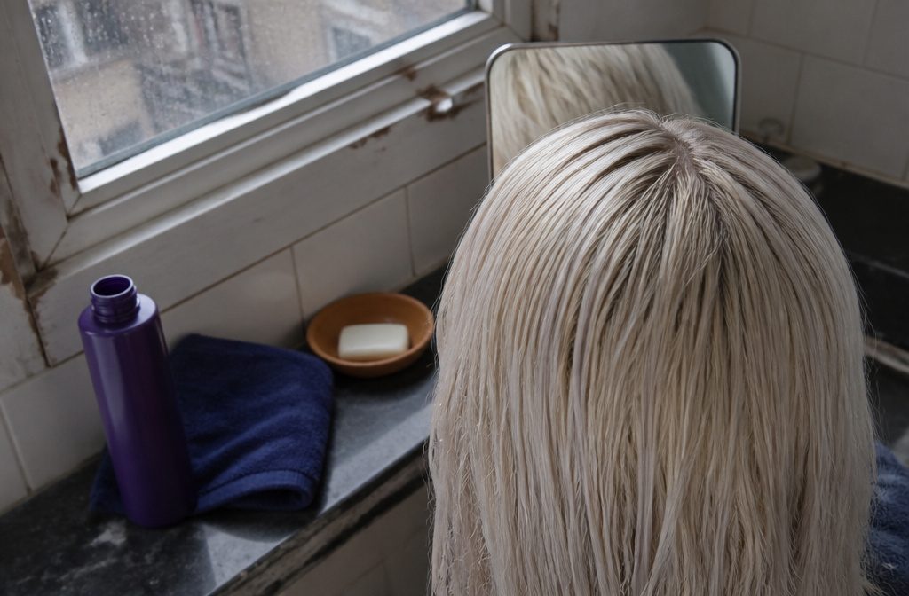 Platinum ice blonde hair with pale lengths and a cool white finish